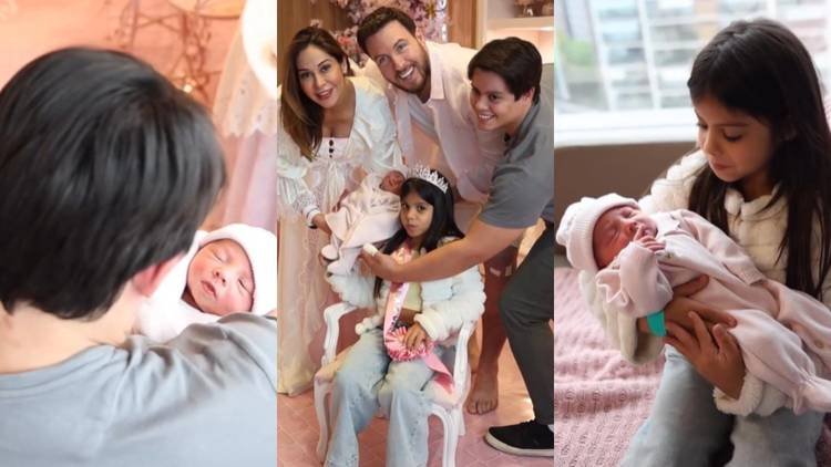 Lucas e Sophia seguram a pequena Eloáh pela primeira vez